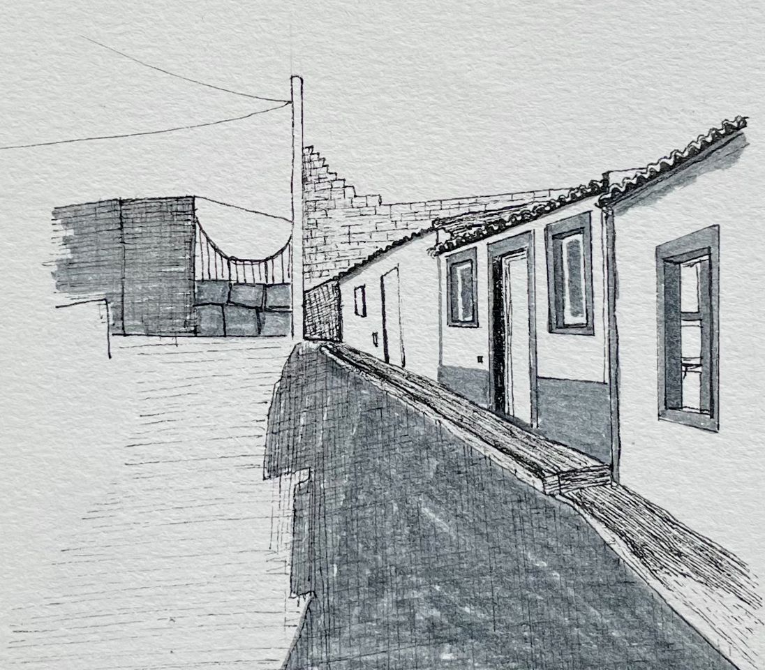 Ink drawing of a narrow street with low houses, tiled roofs and a long shadow